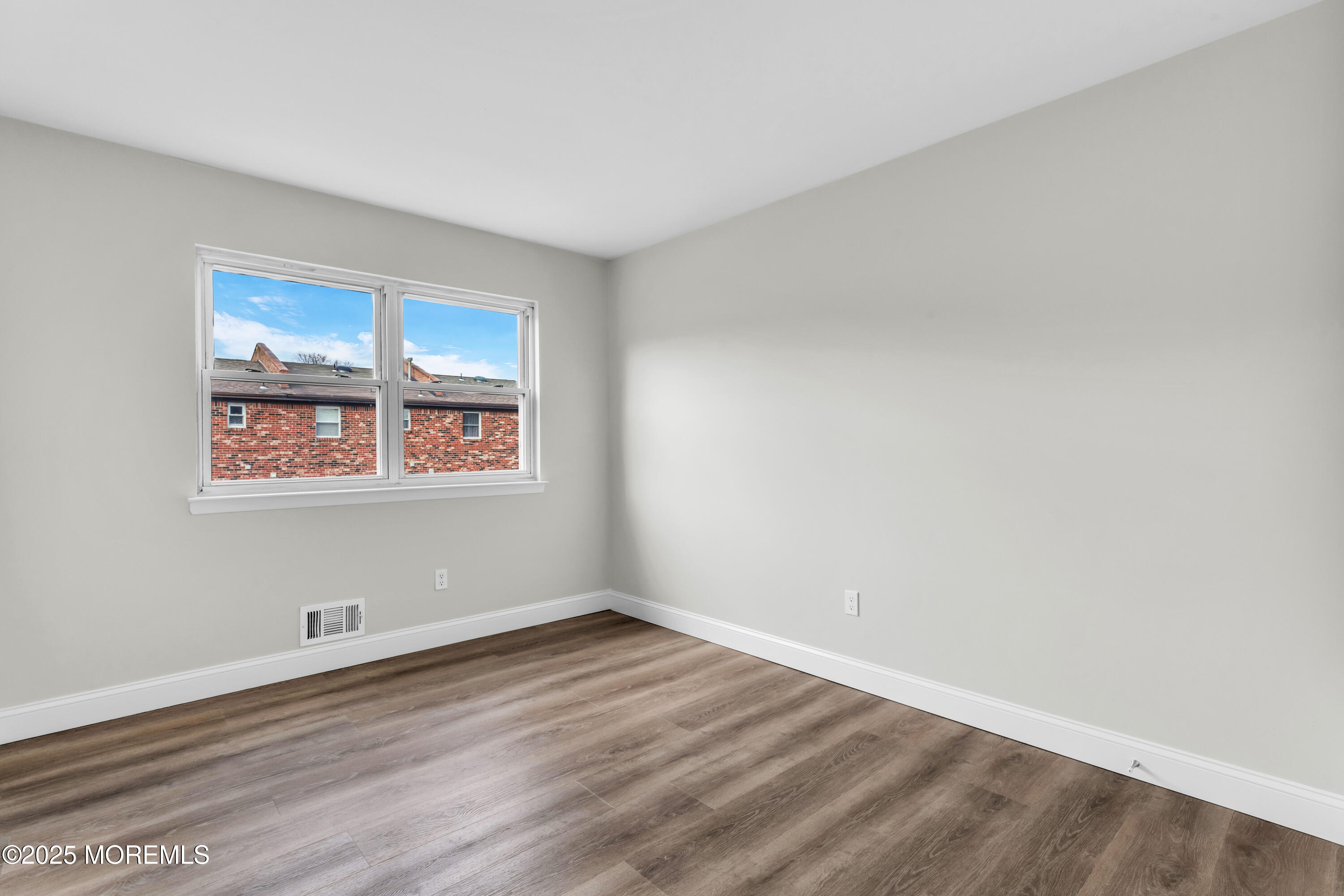 182 Greenwood Loop Road Brick, NJ 08724 - Photo 11 of 19 a view of a room with wooden floor and window