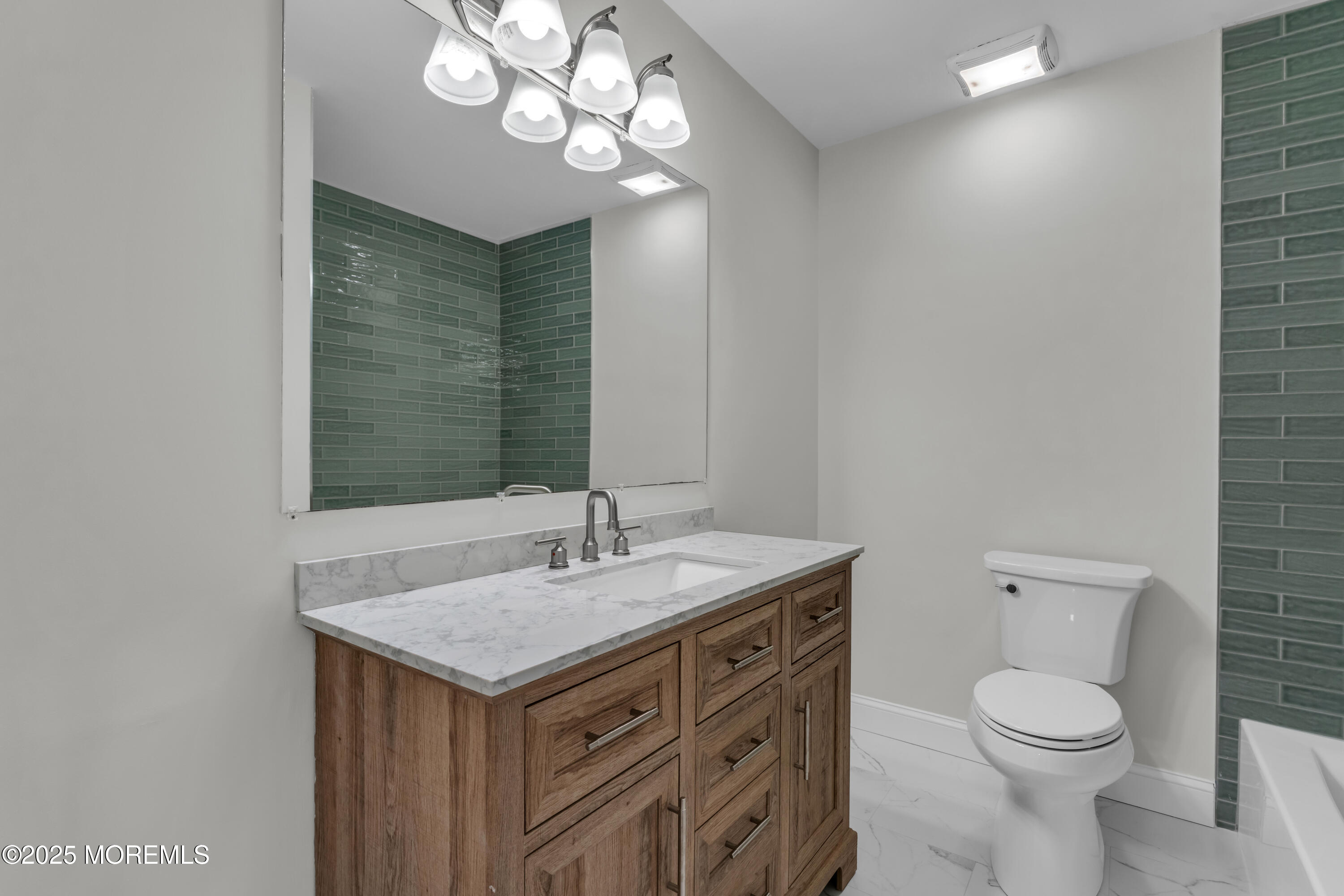 182 Greenwood Loop Road Brick, NJ 08724 - Photo 14 of 19 a bathroom with a sink a toilet and a mirror