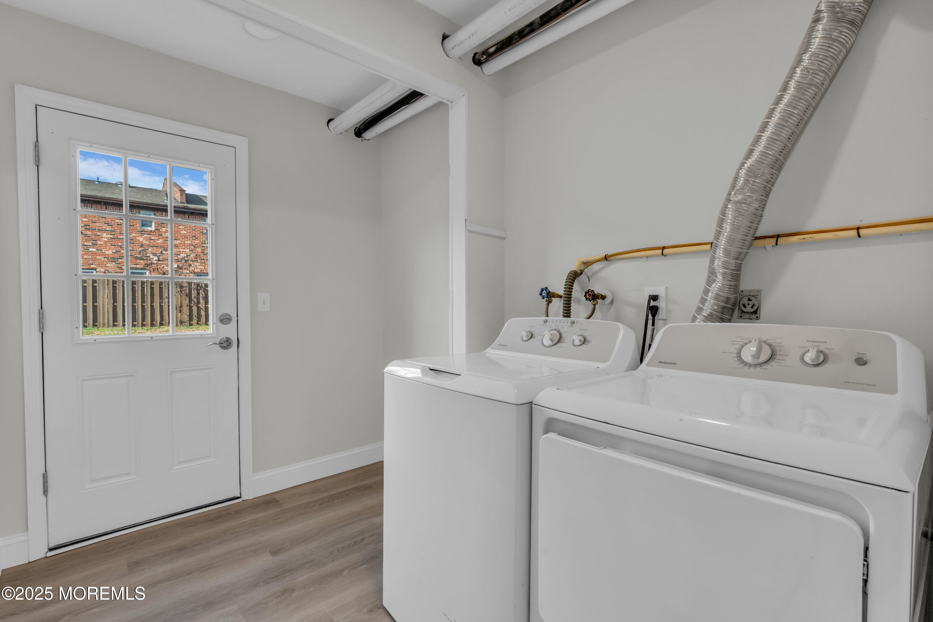 182 Greenwood Loop Road Brick, NJ 08724 - Photo 16 of 19 a utility room with dryer and washer