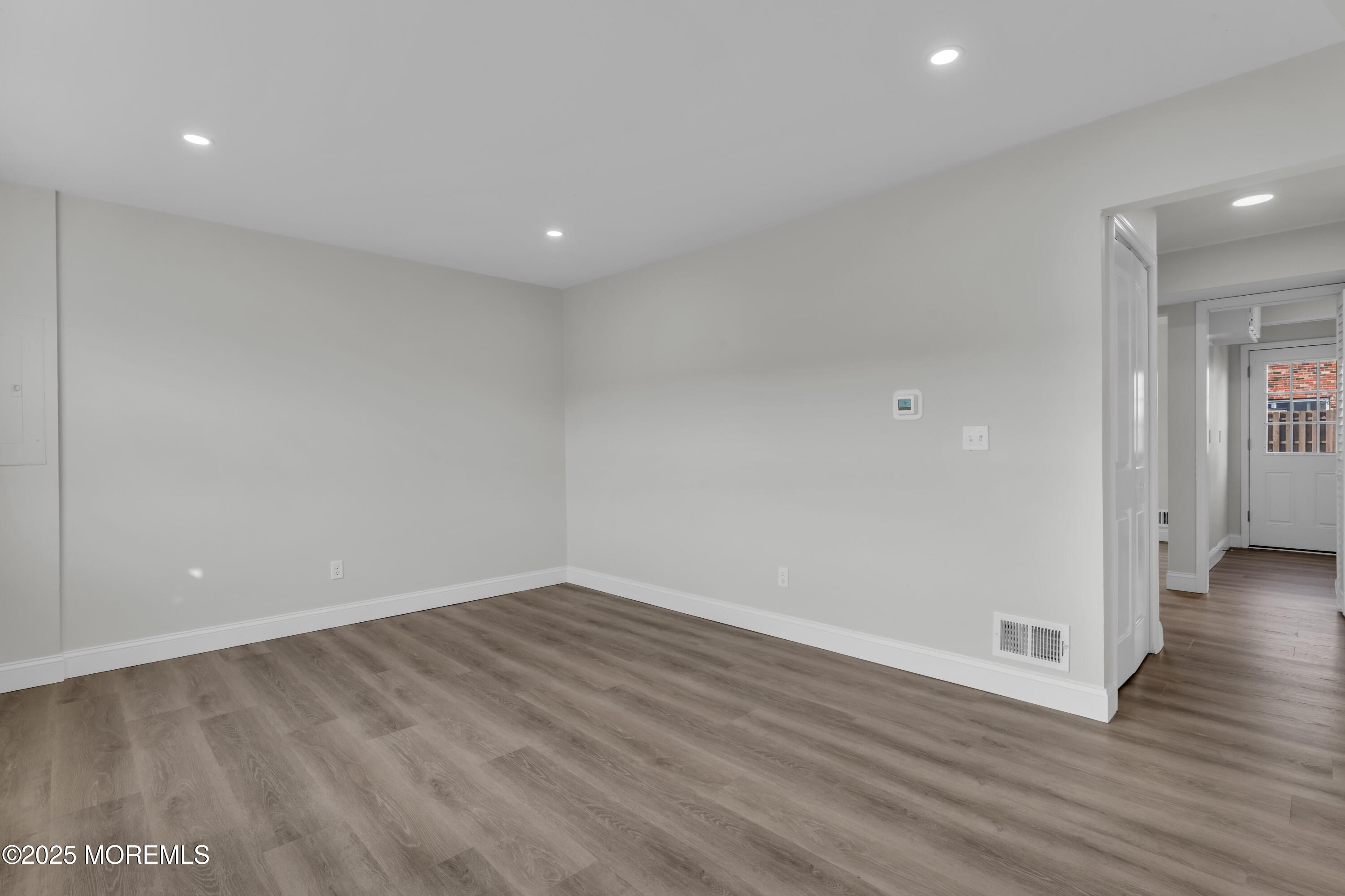 182 Greenwood Loop Road Brick, NJ 08724 - Photo 3 of 19 a view of a room with wooden floor