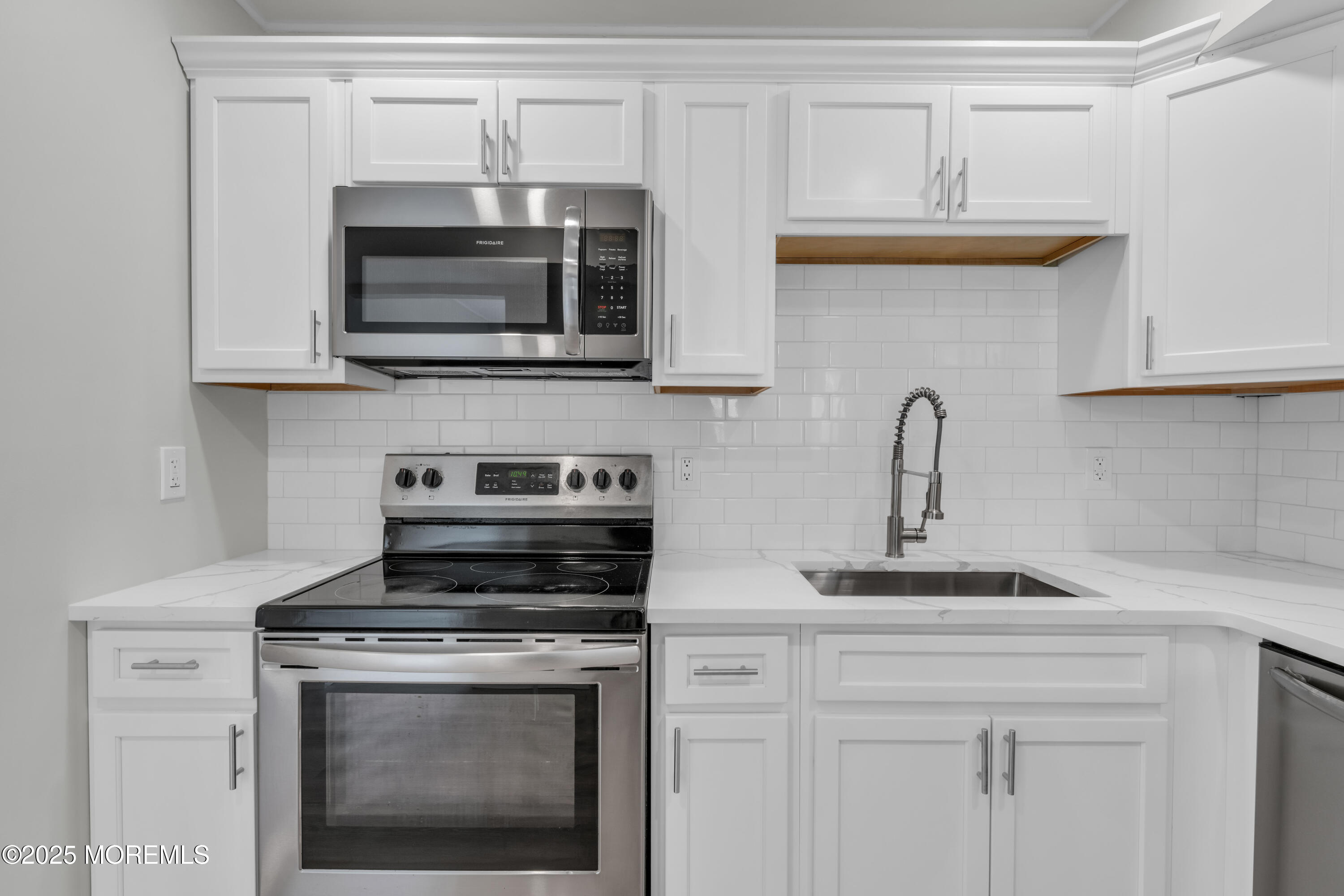 182 Greenwood Loop Road Brick, NJ 08724 - Photo 6 of 19 a kitchen with cabinets stainless steel appliances and a sink