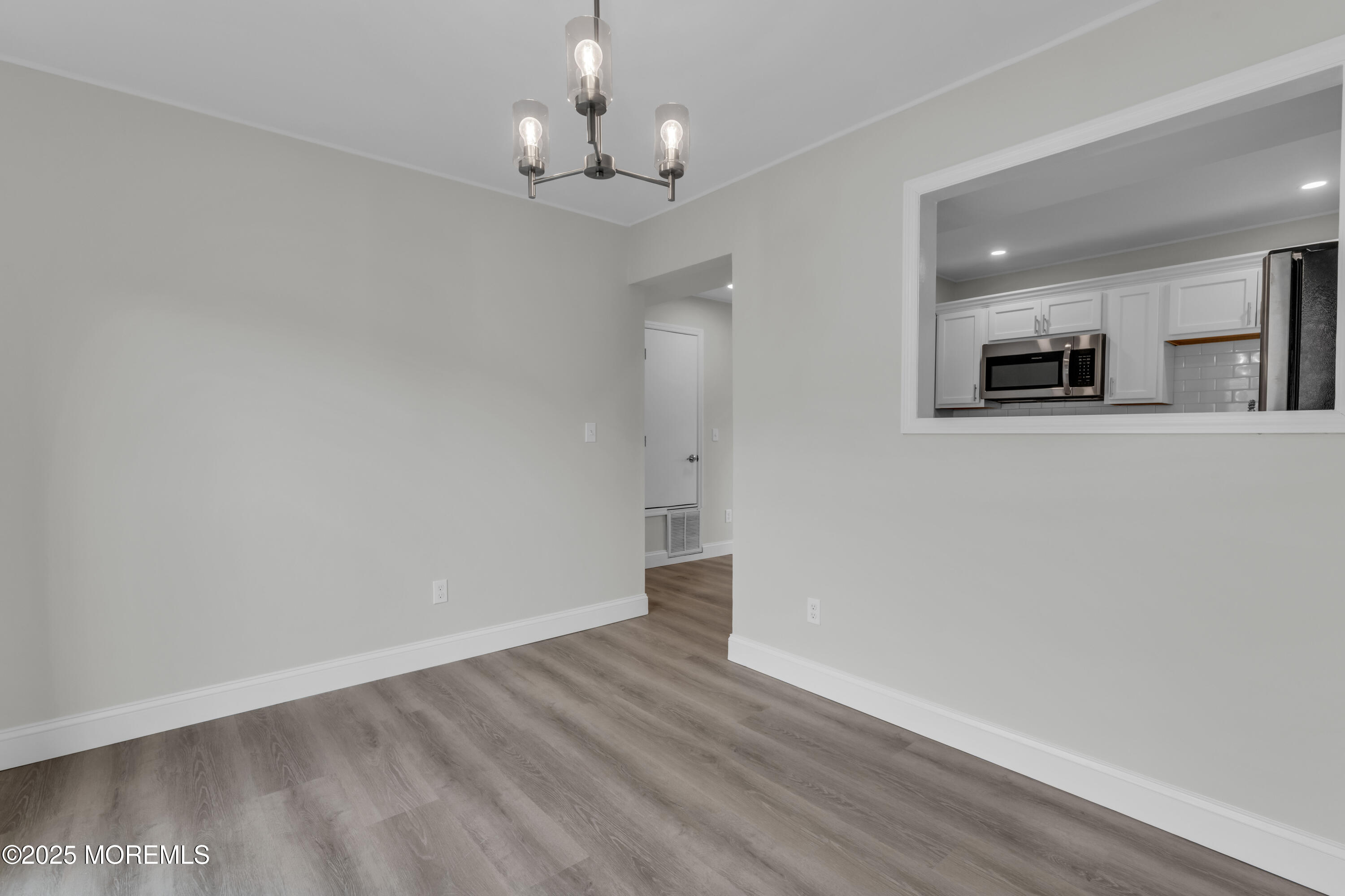 182 Greenwood Loop Road Brick, NJ 08724 - Photo 7 of 19 a view of a kitchen with a sink and a refrigerator