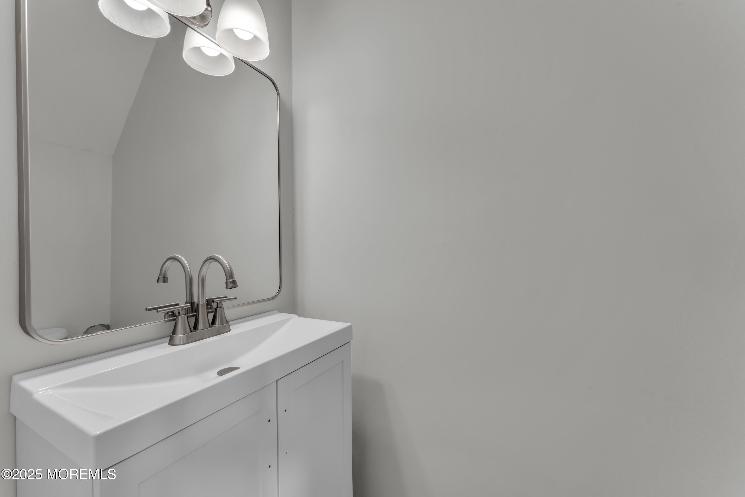 182 Greenwood Loop Road Brick, NJ 08724 - Photo 9 of 19 a bathroom with a sink and a mirror