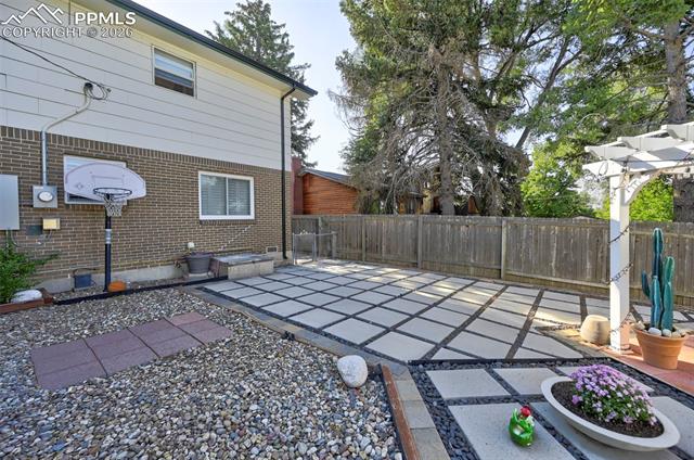 1012 North Chelton Road Colorado Springs, CO 80909 - Photo 9 of 46 Fenced backyard featuring a patio area