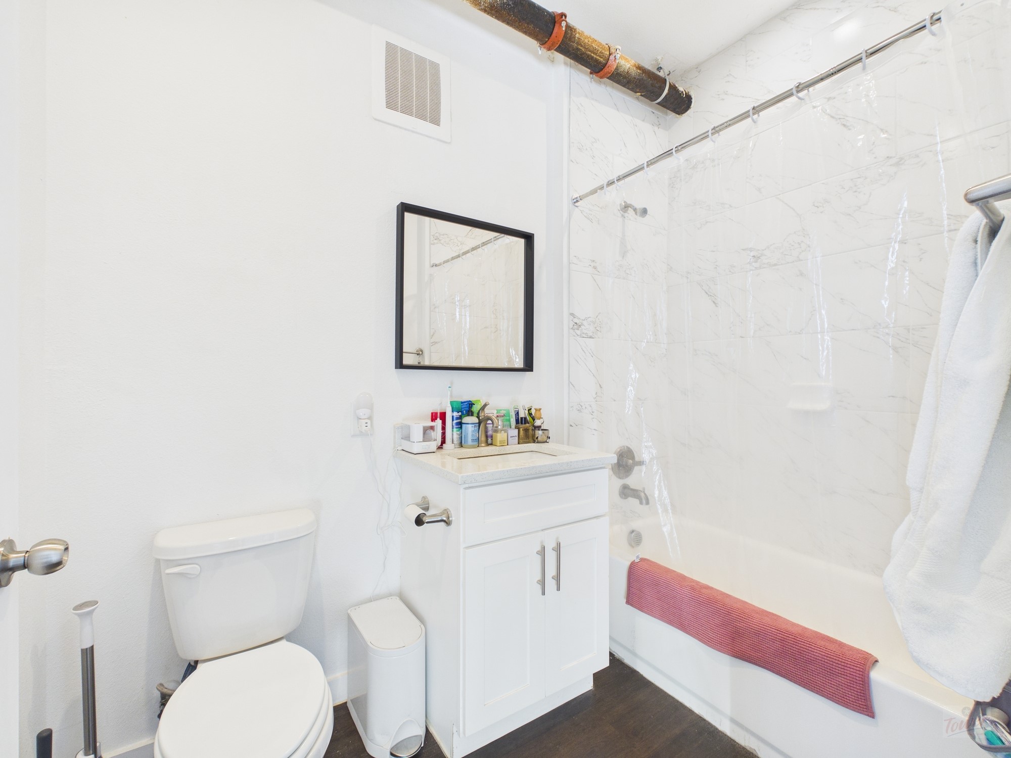 1010 West 26th Street, Unit 505 Austin, TX 78705 - Photo 6 of 6 a bathroom with a sink a toilet and a shower