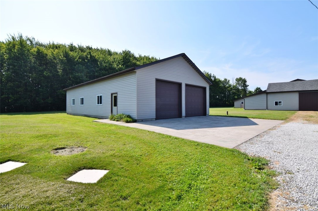 15227 Leroy Road Thompson, OH 44086 - Photo 6 of 50 Oversized garage/pole barn with heated and insulated workshop in the back.
