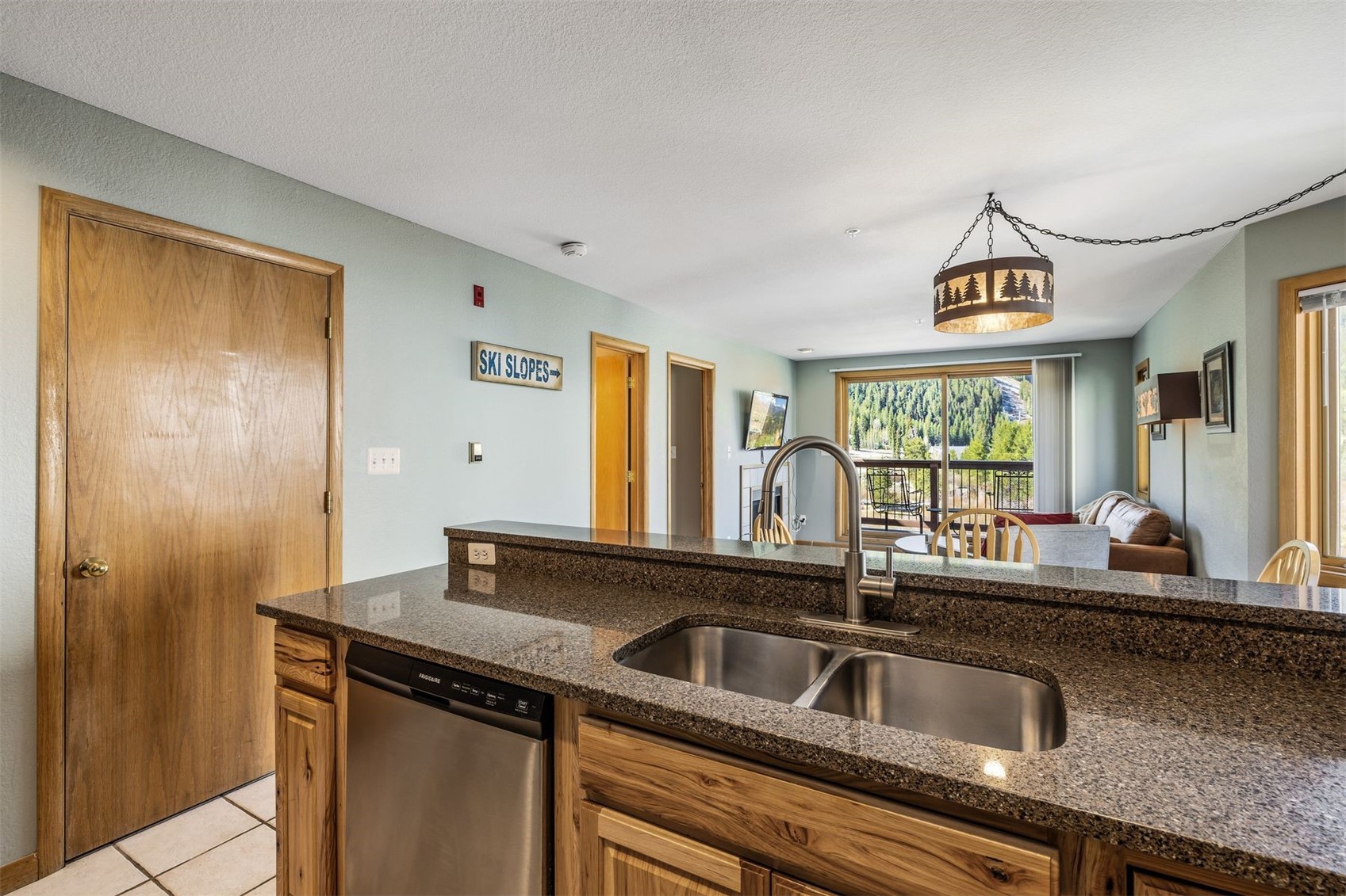 60 Oro Grande Road, Unit 204 Keystone, CO 80435 - Photo 11 of 50 a kitchen with a sink and a window