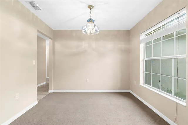 an empty room with a windows