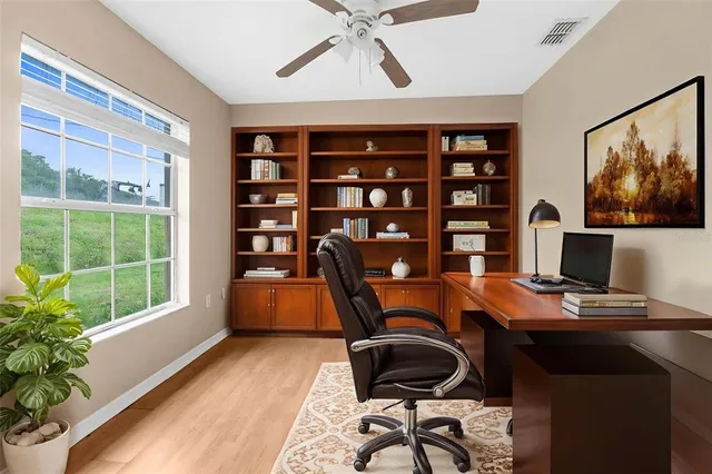 a workspace with furniture and window