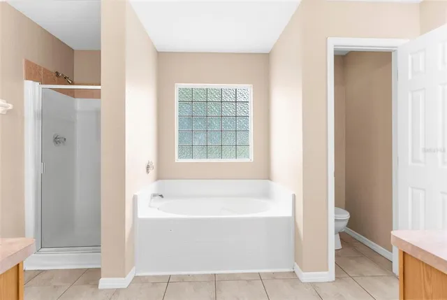 a white bath tub sitting next to a white sink