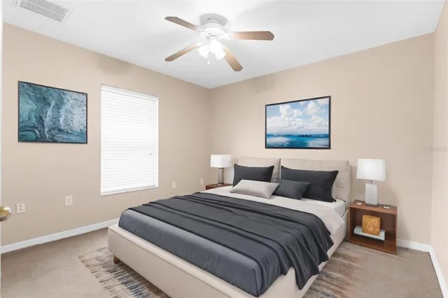 a bedroom with bed and window