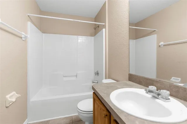 a bathroom with a sink a toilet and a bathtub