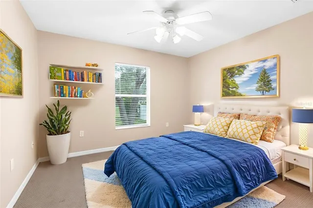 a bedroom with bed and a window