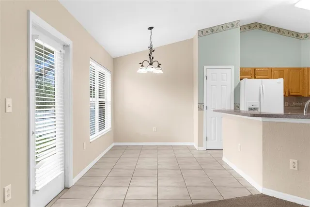 a view of a room with a window and brick walls
