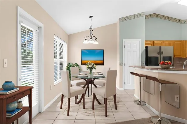 a view of a dining room with furniture window and outside view