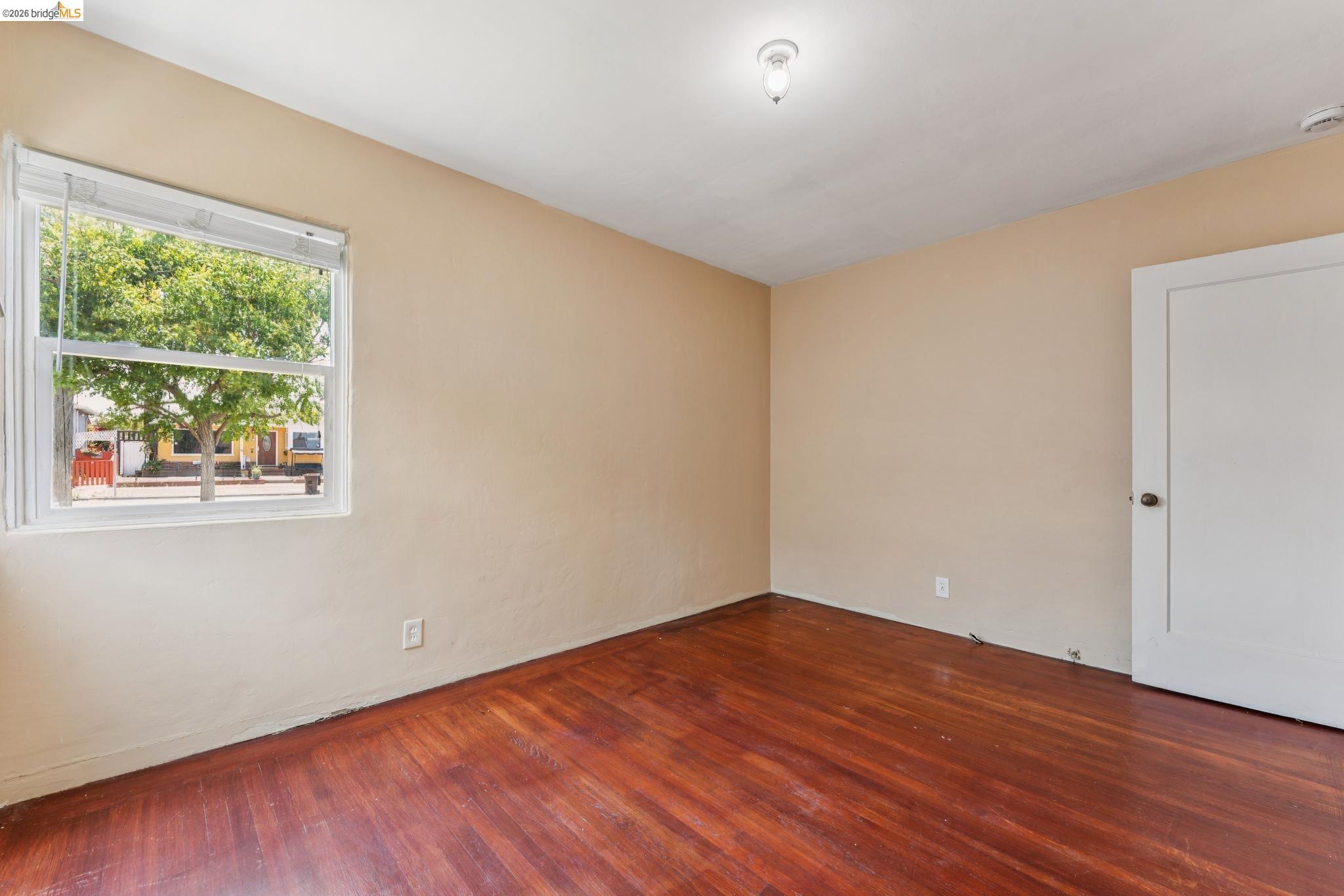 2879 Rheem Avenue Richmond, CA 94804 - Photo 28 of 45 Room with rich wood-finish flooring, light tan walls, and a white ceiling