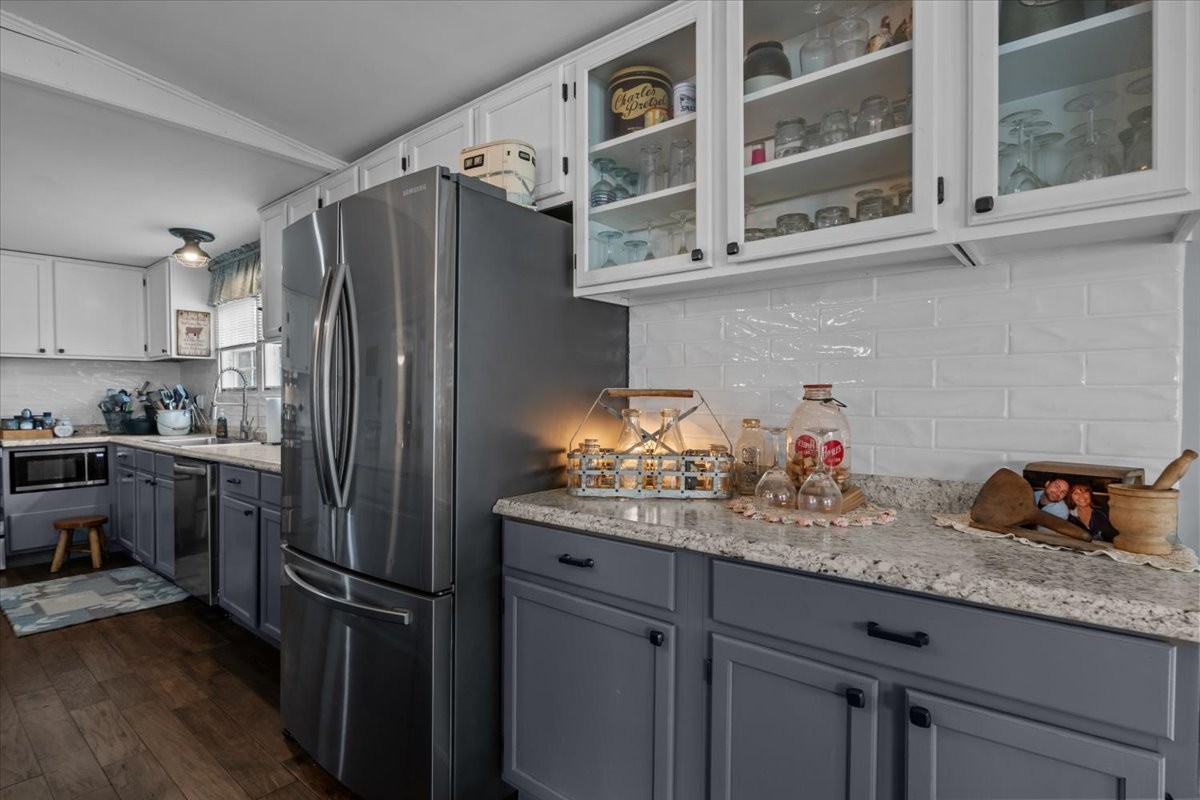 25 Cardinal Road Linden, TN 37096 - Photo 12 of 84 a kitchen with stainless steel appliances granite countertop a refrigerator and a sink