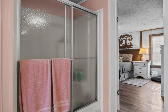 a view of a house with backyard and trees