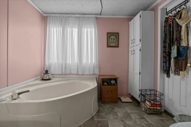 a view of a backyard with sitting area