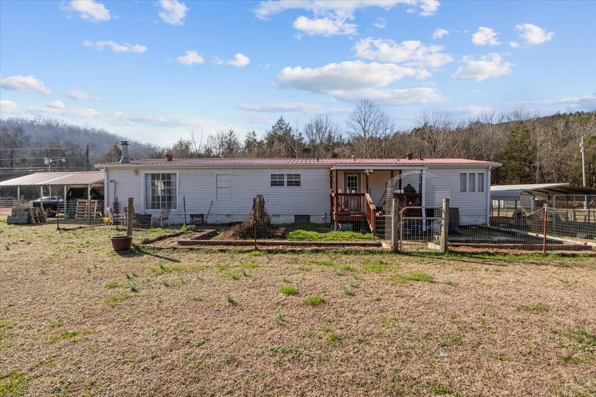 25 Cardinal Road Linden, TN 37096 - Photo 28 of 84 a view of a house with swimming pool and furniture