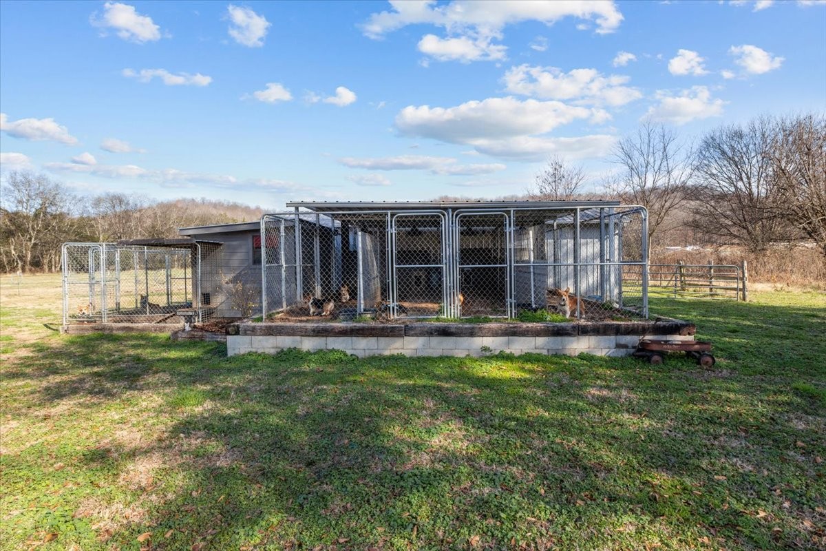 25 Cardinal Road Linden, TN 37096 - Photo 50 of 84 a view of a house with swimming pool and porch with furniture