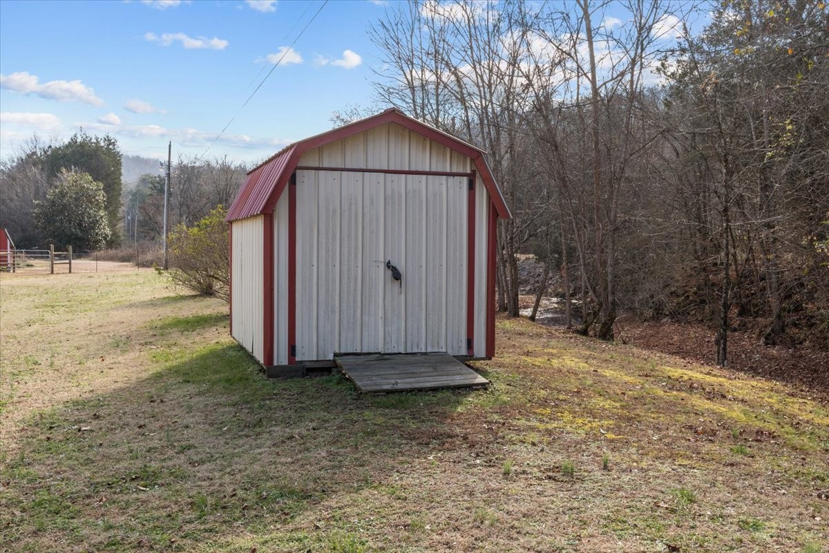25 Cardinal Road Linden, TN 37096 - Photo 52 of 84 a view of backyard with small cabin