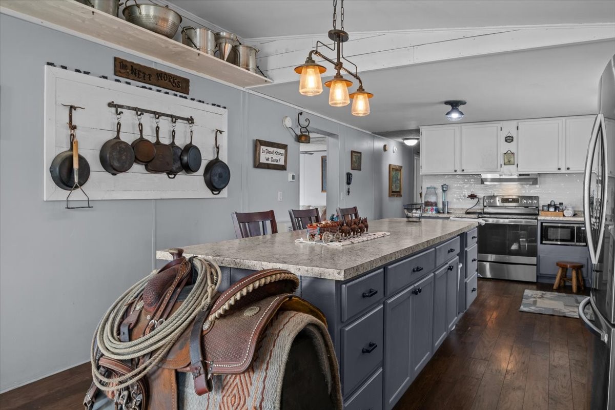 25 Cardinal Road Linden, TN 37096 - Photo 9 of 84 a kitchen with a sink a stove and cabinets