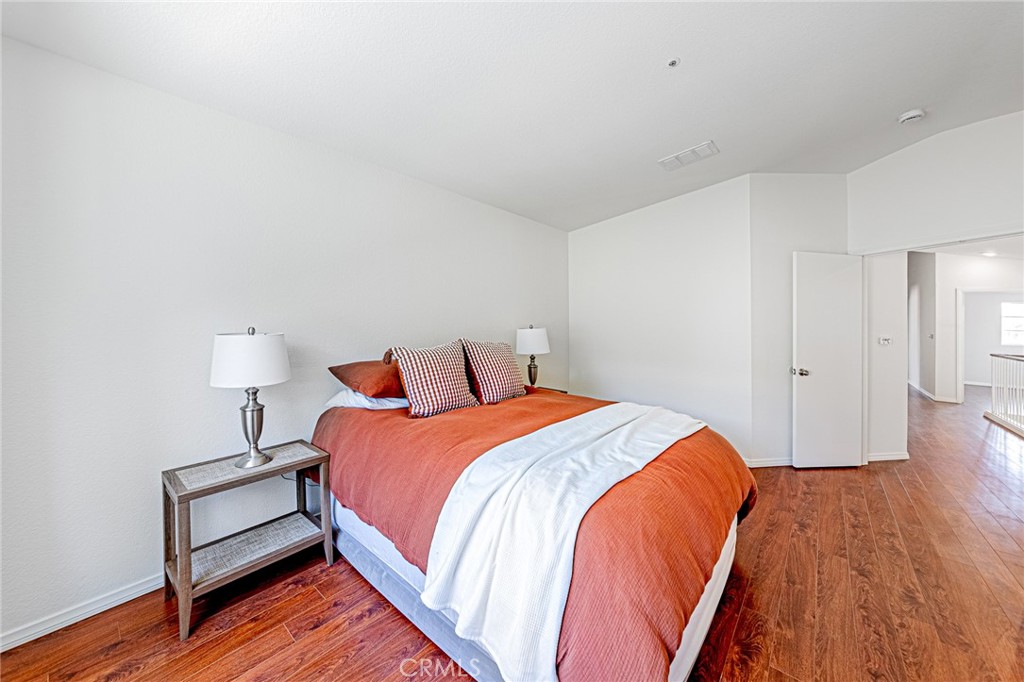 15377 Tobarra Road Fontana, CA 92337 - Photo 18 of 38 Spacious primary bedroom offering comfort and natural light