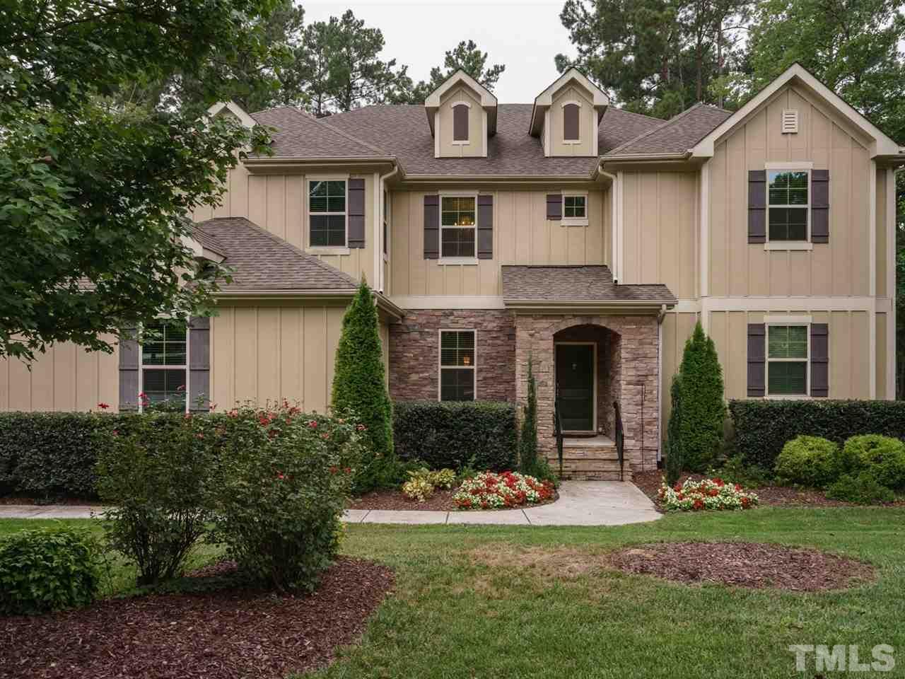 4844 Inwood Road Raleigh, NC 27603 - Photo 1 of 25 a front view of a house with a yard and garage