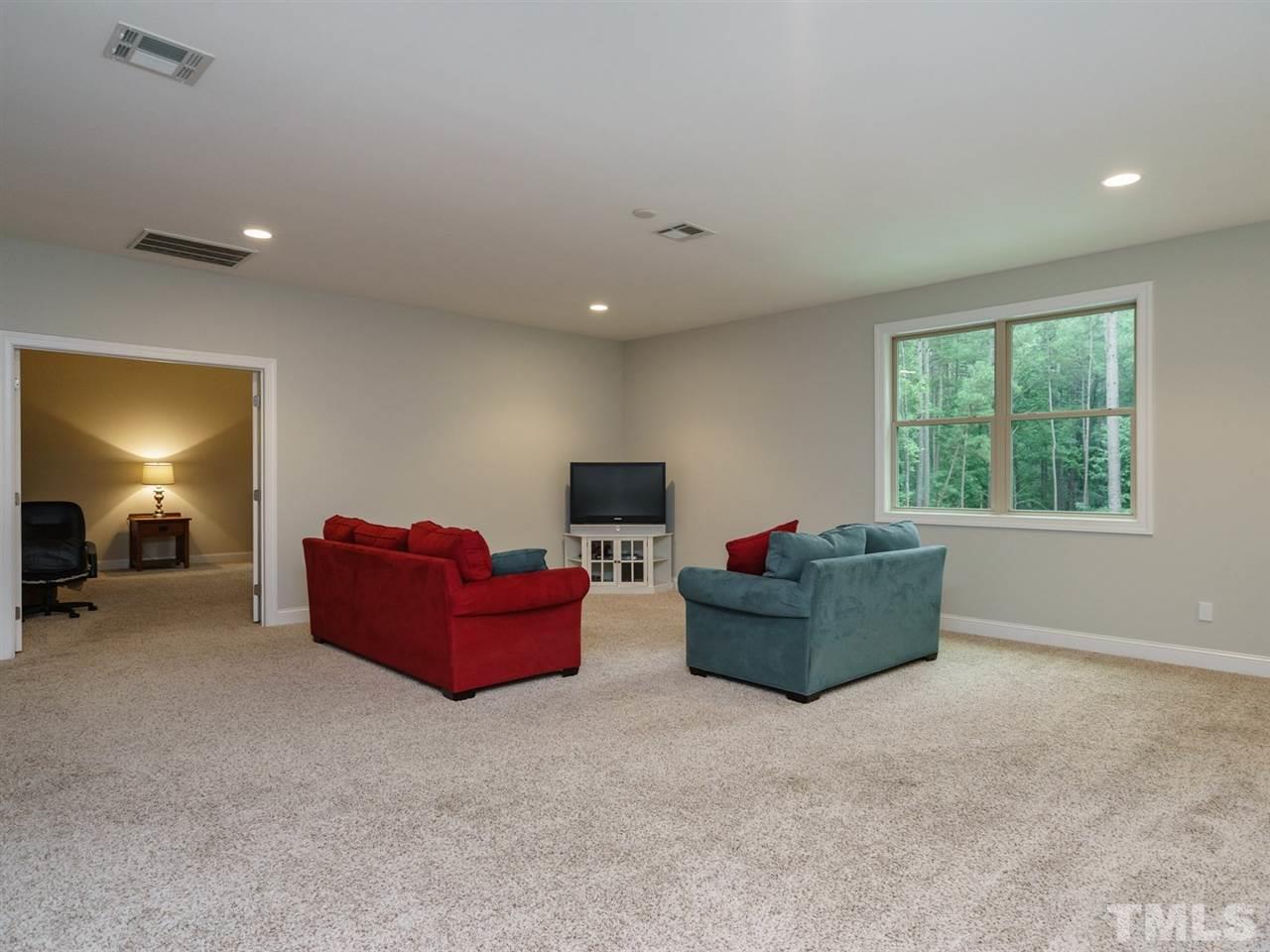 4844 Inwood Road Raleigh, NC 27603 - Photo 14 of 25 a living room with furniture and a window