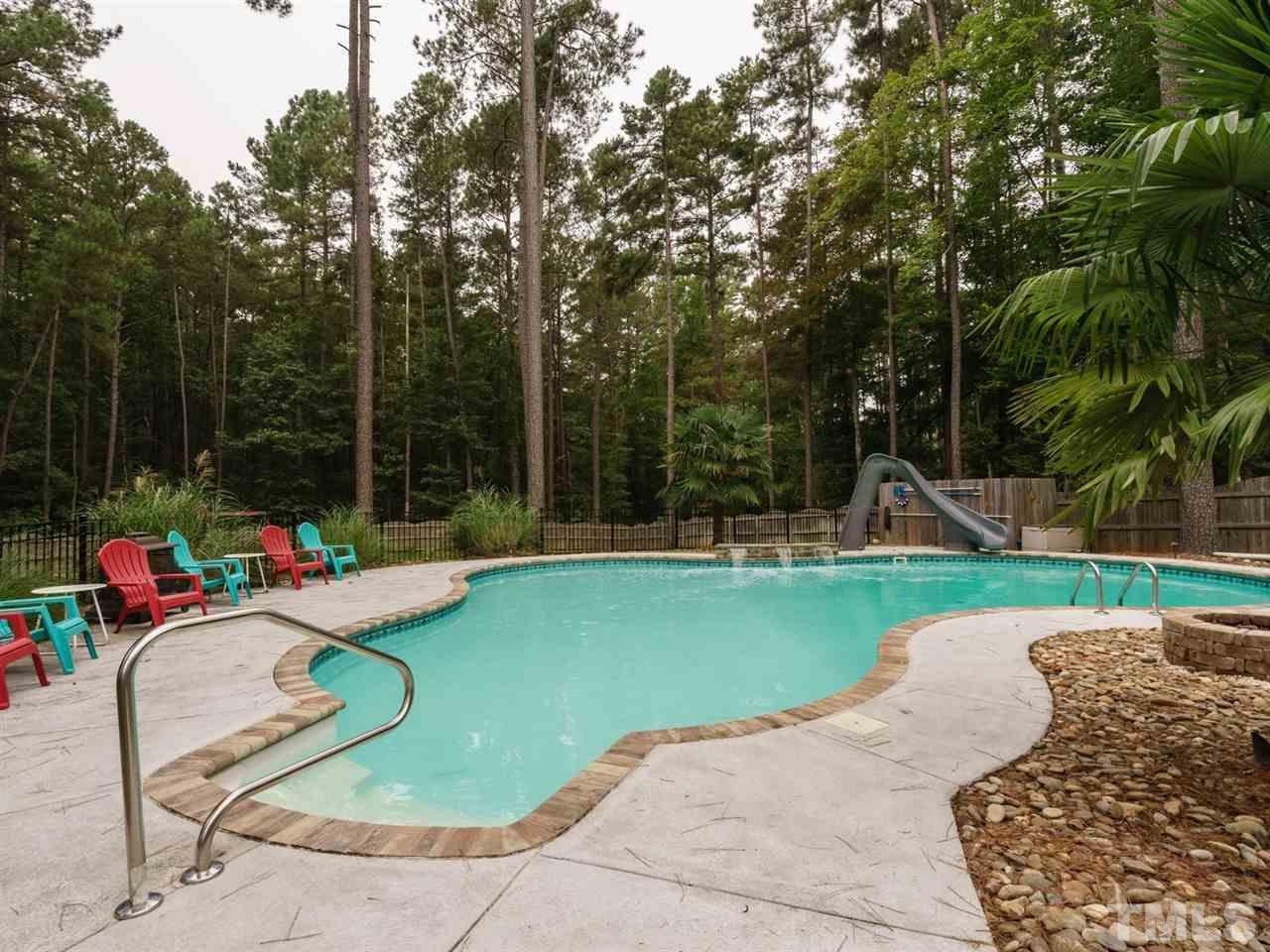 4844 Inwood Road Raleigh, NC 27603 - Photo 20 of 25 a view of a backyard with sitting area and slide