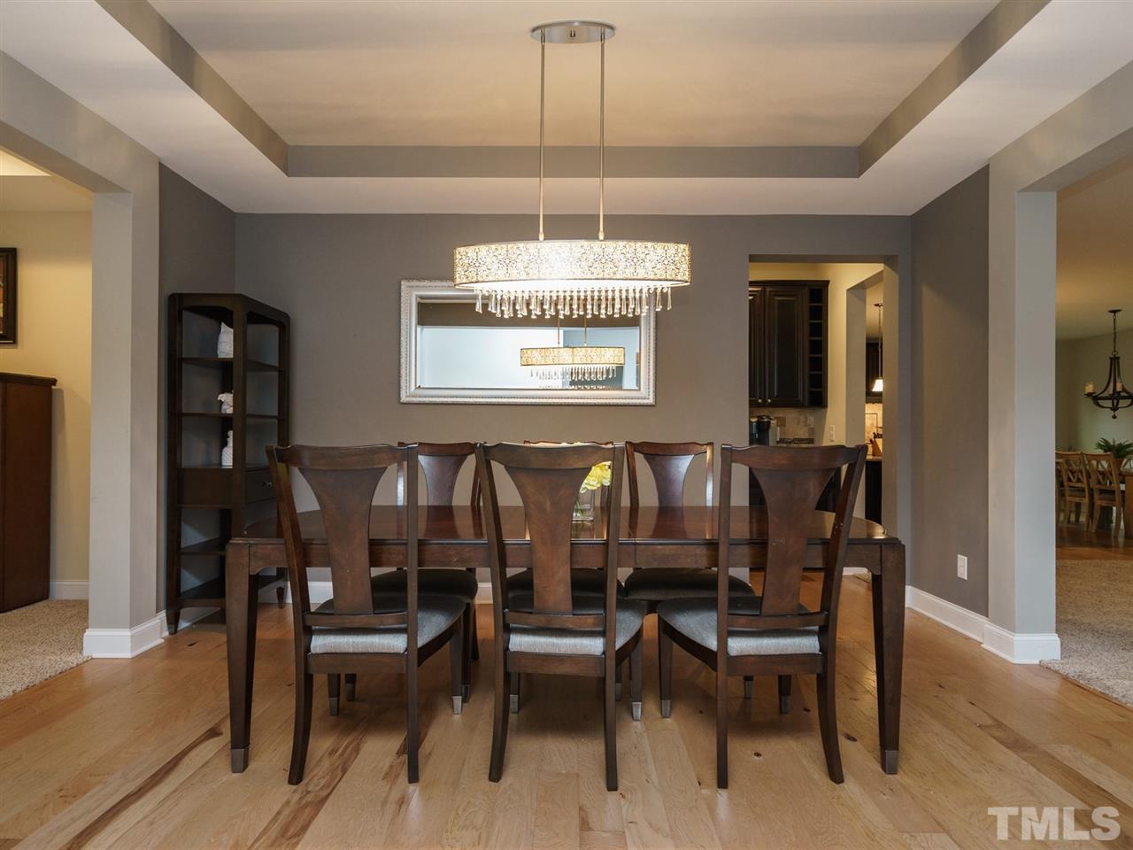 4844 Inwood Road Raleigh, NC 27603 - Photo 3 of 25 a view of a dining room with furniture window and wooden floor