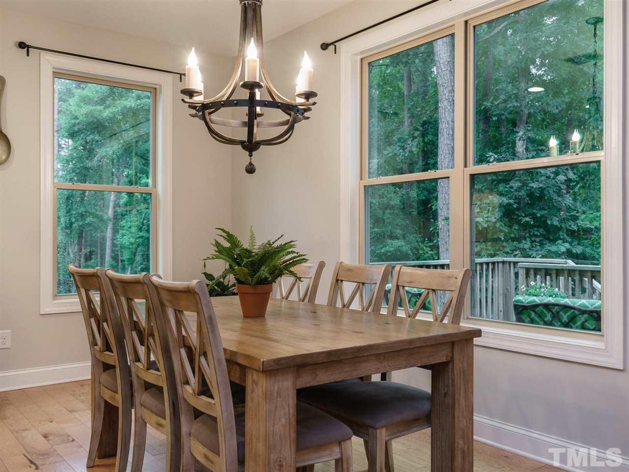 4844 Inwood Road Raleigh, NC 27603 - Photo 7 of 25 a view of a dining room with furniture window and outside view