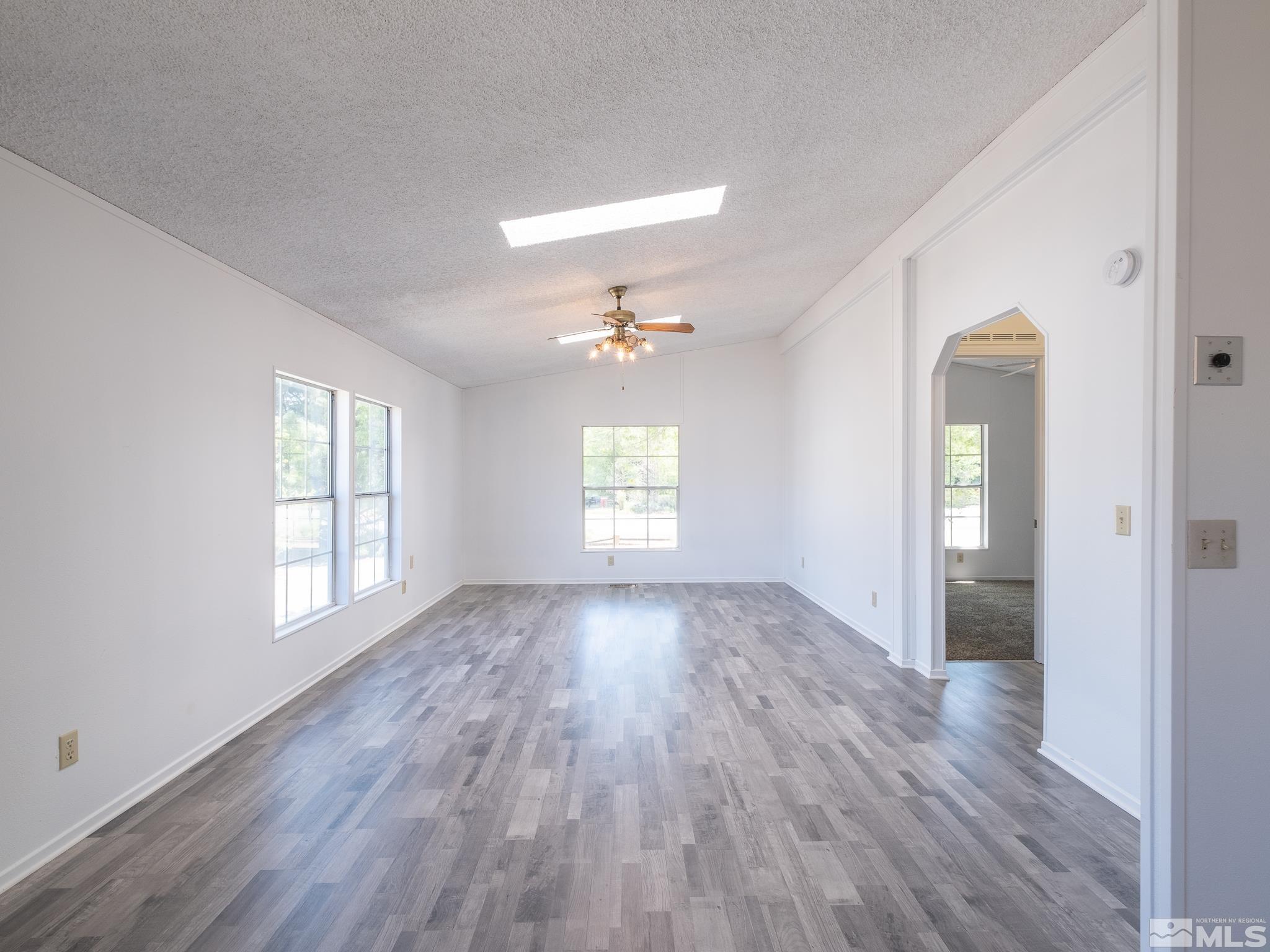 3975 Sandpiper Drive Reno, NV 89508 - Photo 15 of 35 an empty room with wooden floor and windows