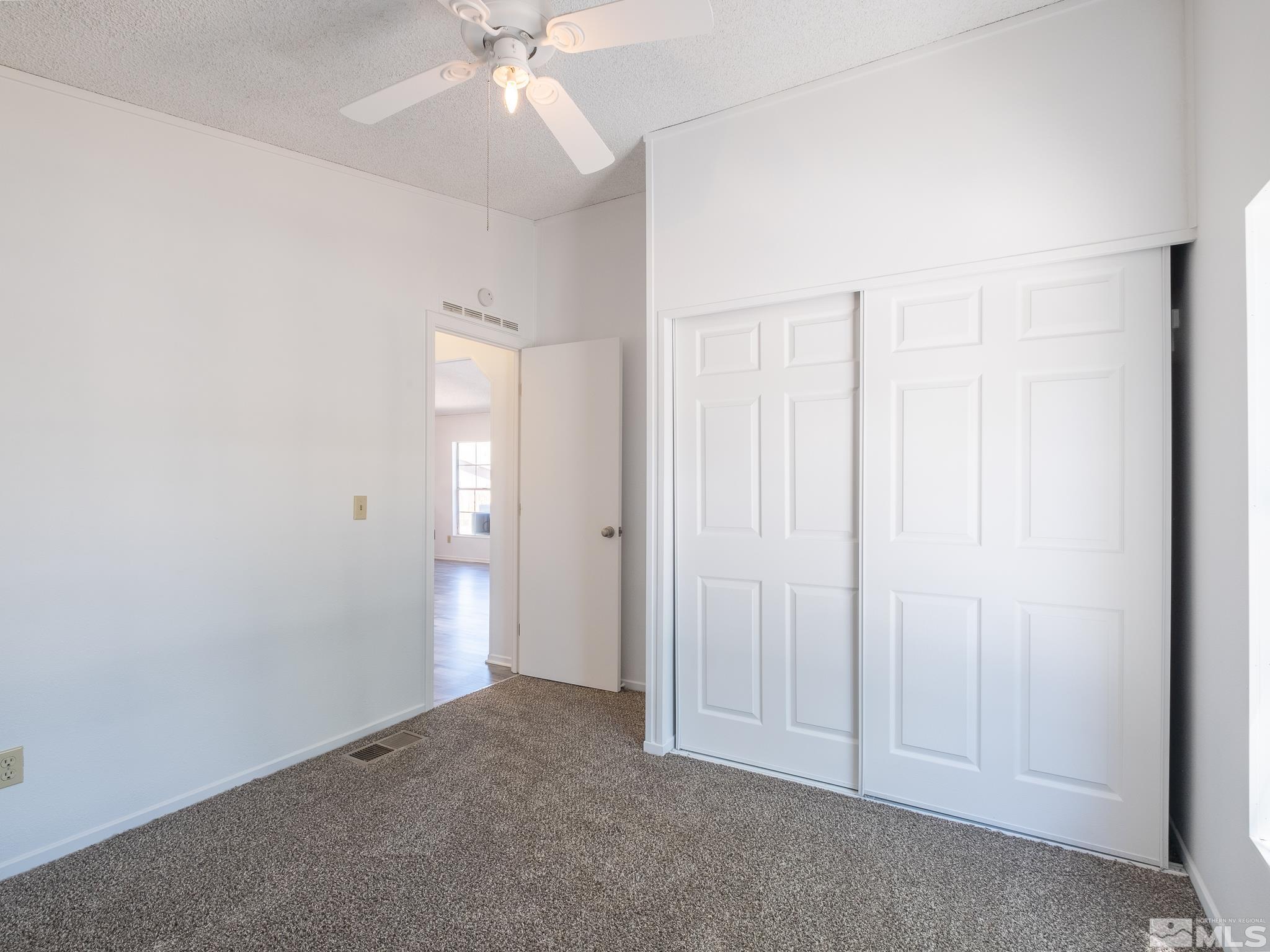 3975 Sandpiper Drive Reno, NV 89508 - Photo 24 of 35 an empty room with fan and entryway