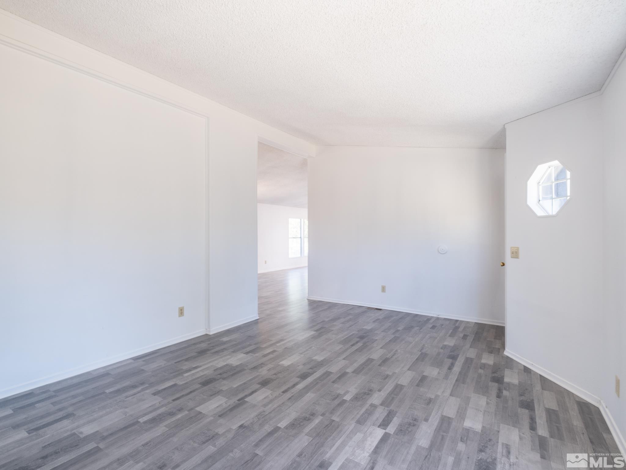 3975 Sandpiper Drive Reno, NV 89508 - Photo 7 of 35 a view of an empty room and wooden floor