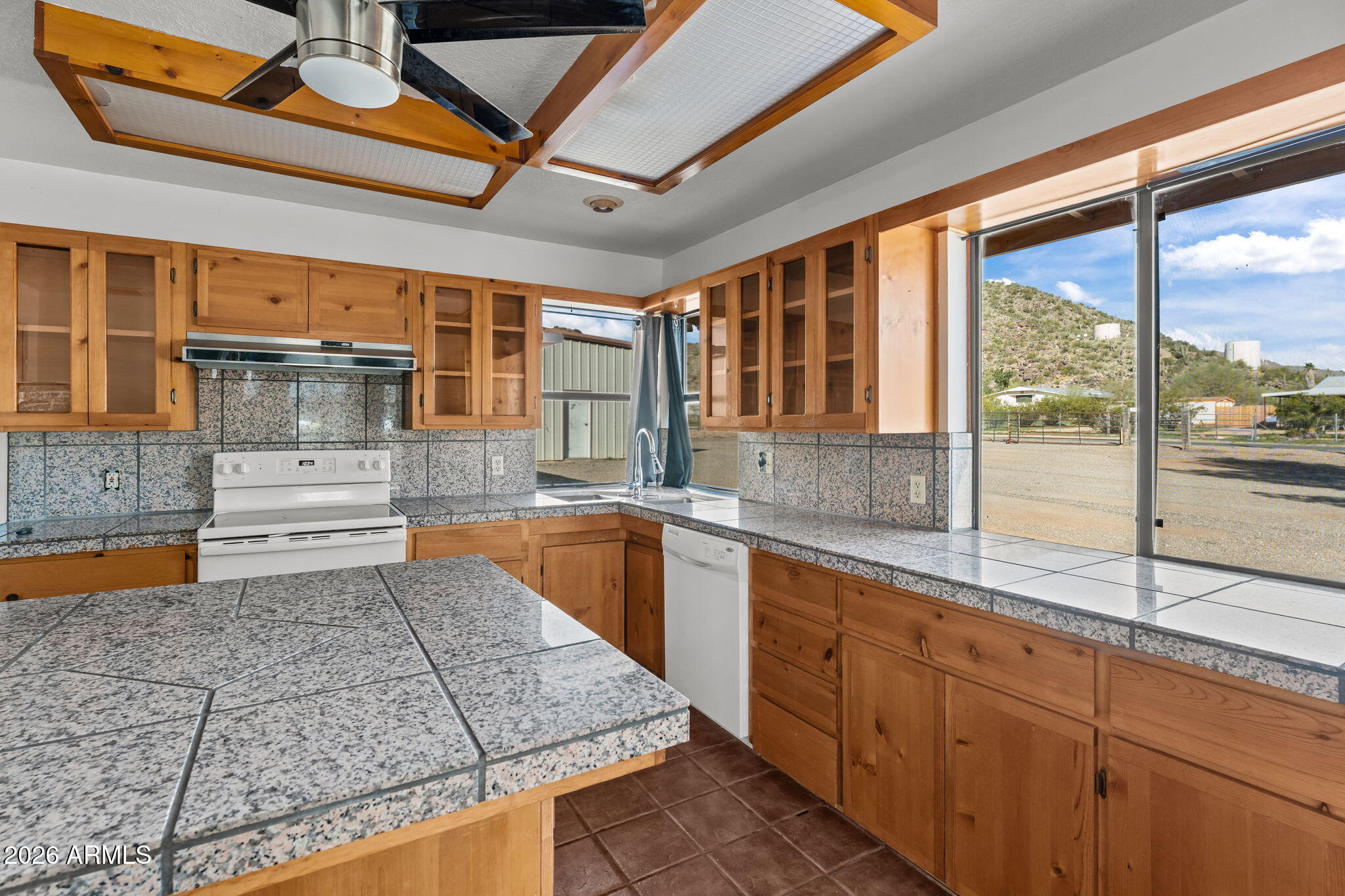 22905 Ranch Road Congress, AZ 85332 - Photo 12 of 26 a kitchen with sink a stove and cabinets