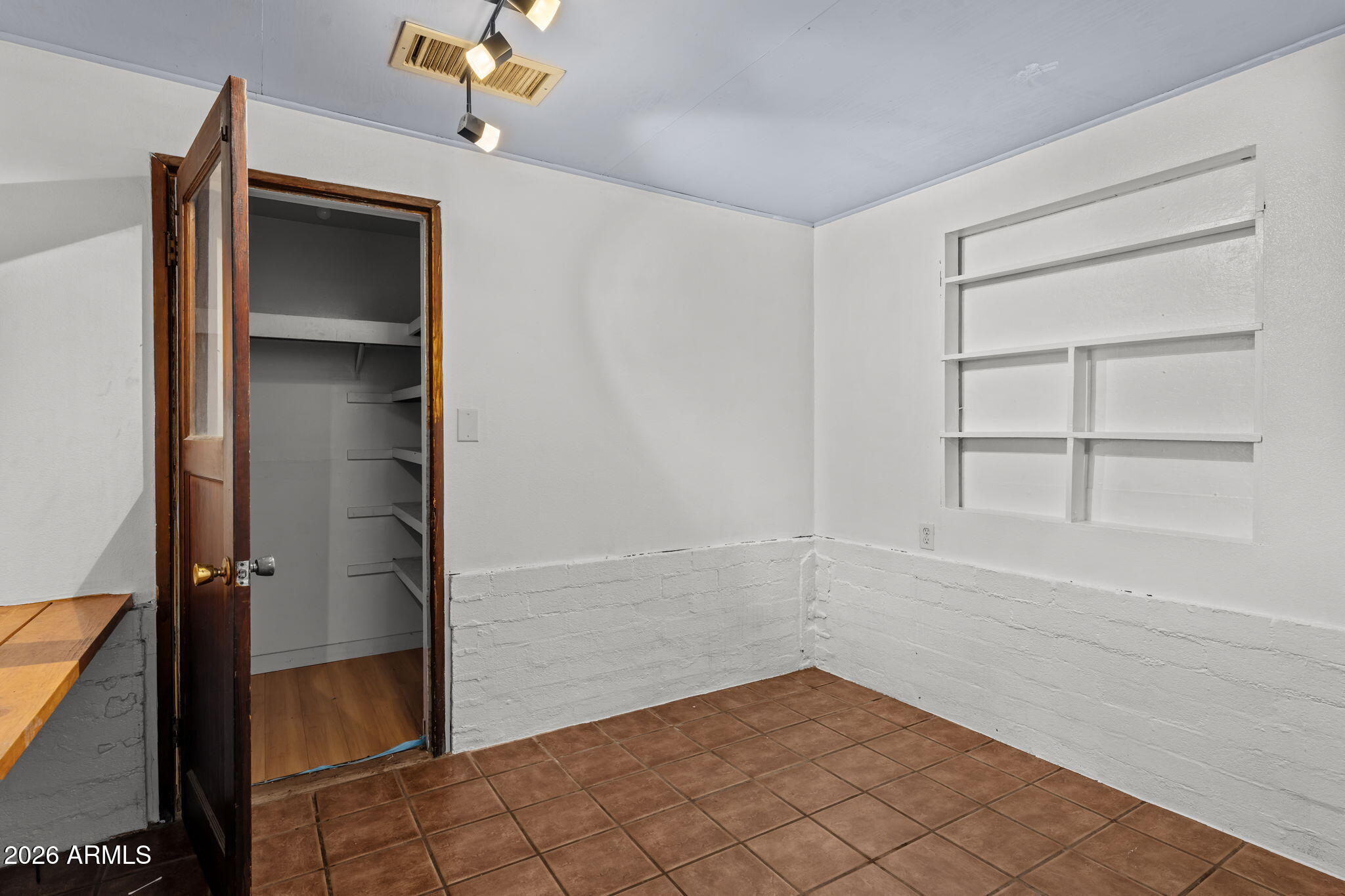 22905 Ranch Road Congress, AZ 85332 - Photo 17 of 26 a view of an empty room with cabinet and a window
