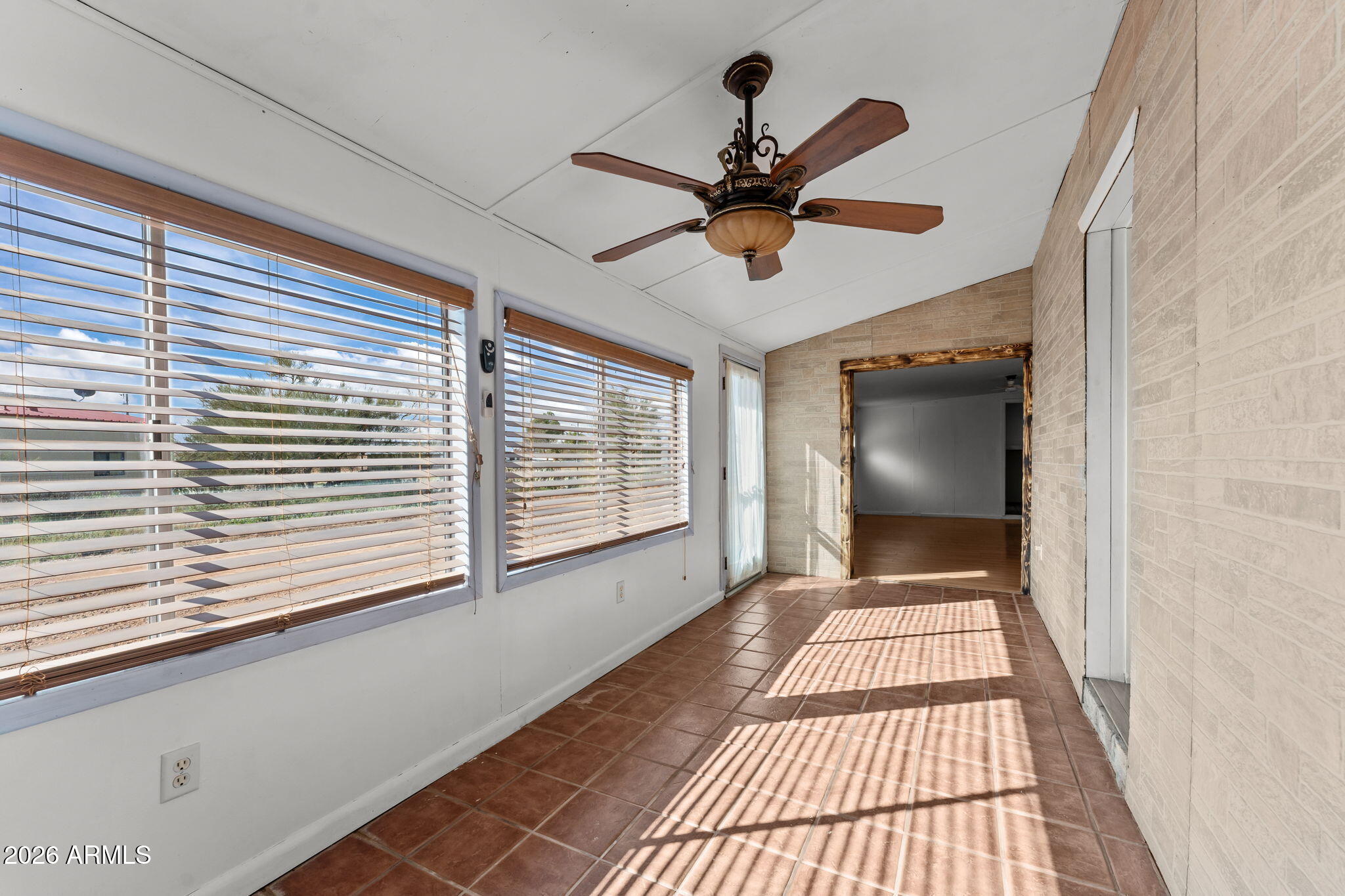 22905 Ranch Road Congress, AZ 85332 - Photo 20 of 26 a view of empty room with wooden floor and fan