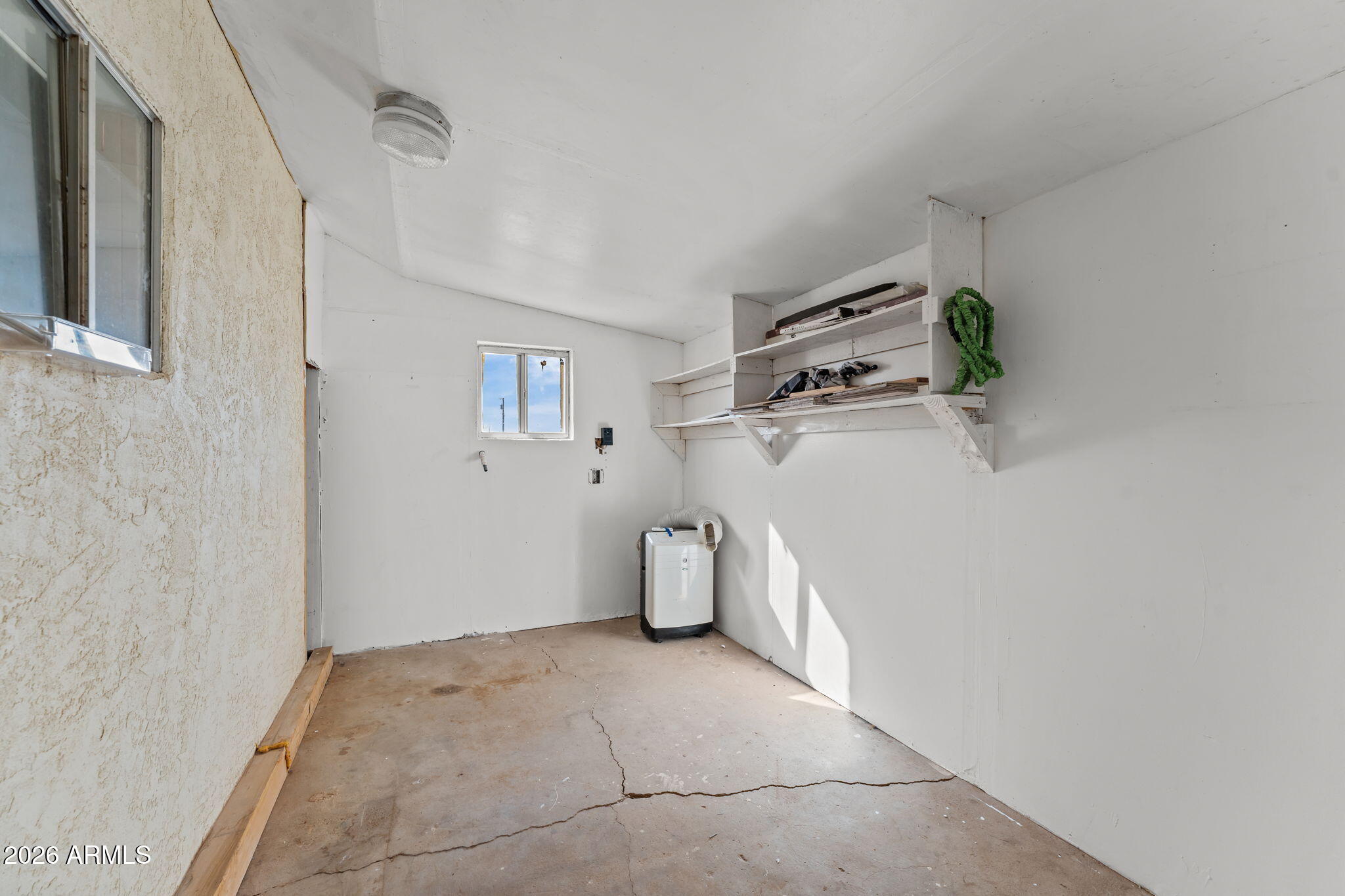 22905 Ranch Road Congress, AZ 85332 - Photo 23 of 26 a view of a storage & utility room with refrigerator
