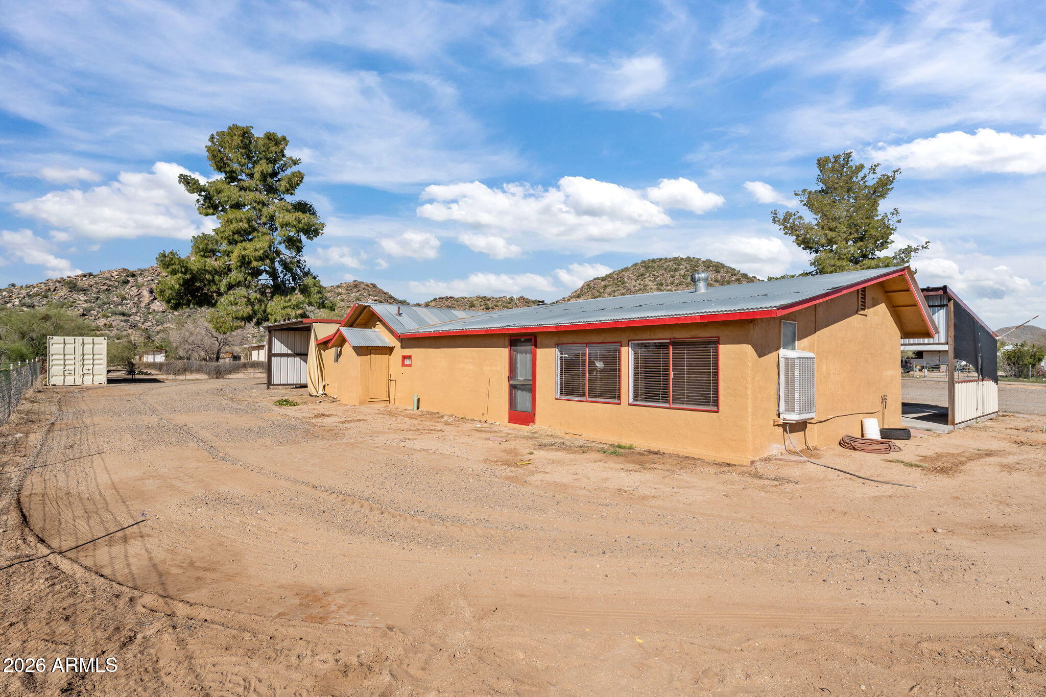 22905 Ranch Road Congress, AZ 85332 - Photo 7 of 26 a front view of a house with a yard and garage