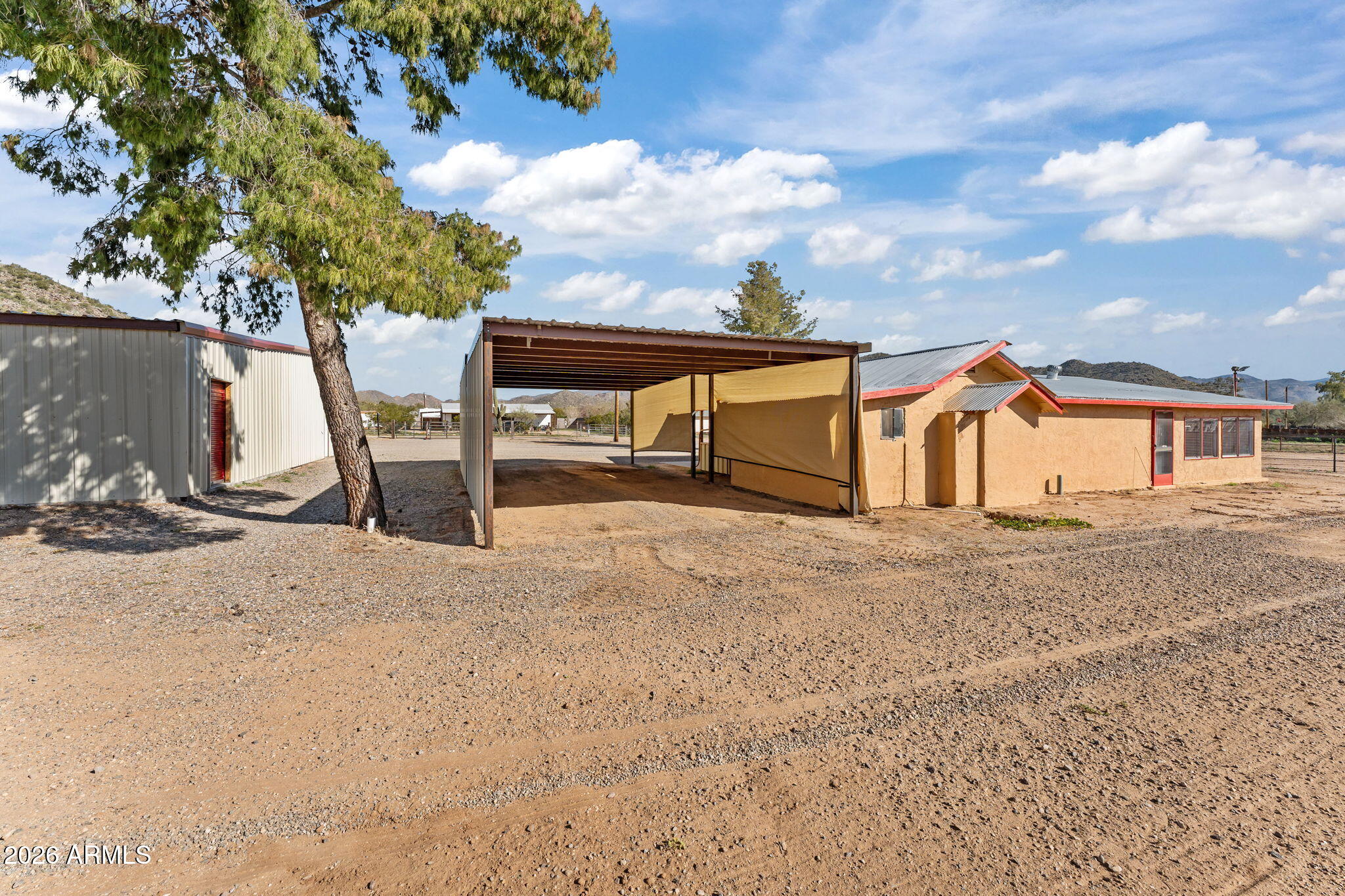22905 Ranch Road Congress, AZ 85332 - Photo 8 of 26 a view of a house with backyard and a tree