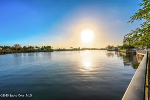 a view of a lake with houses in the background
