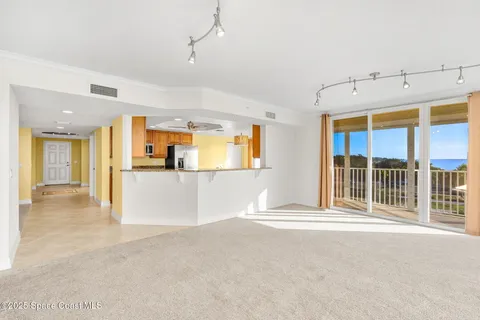 a view of a kitchen with a sink and a window
