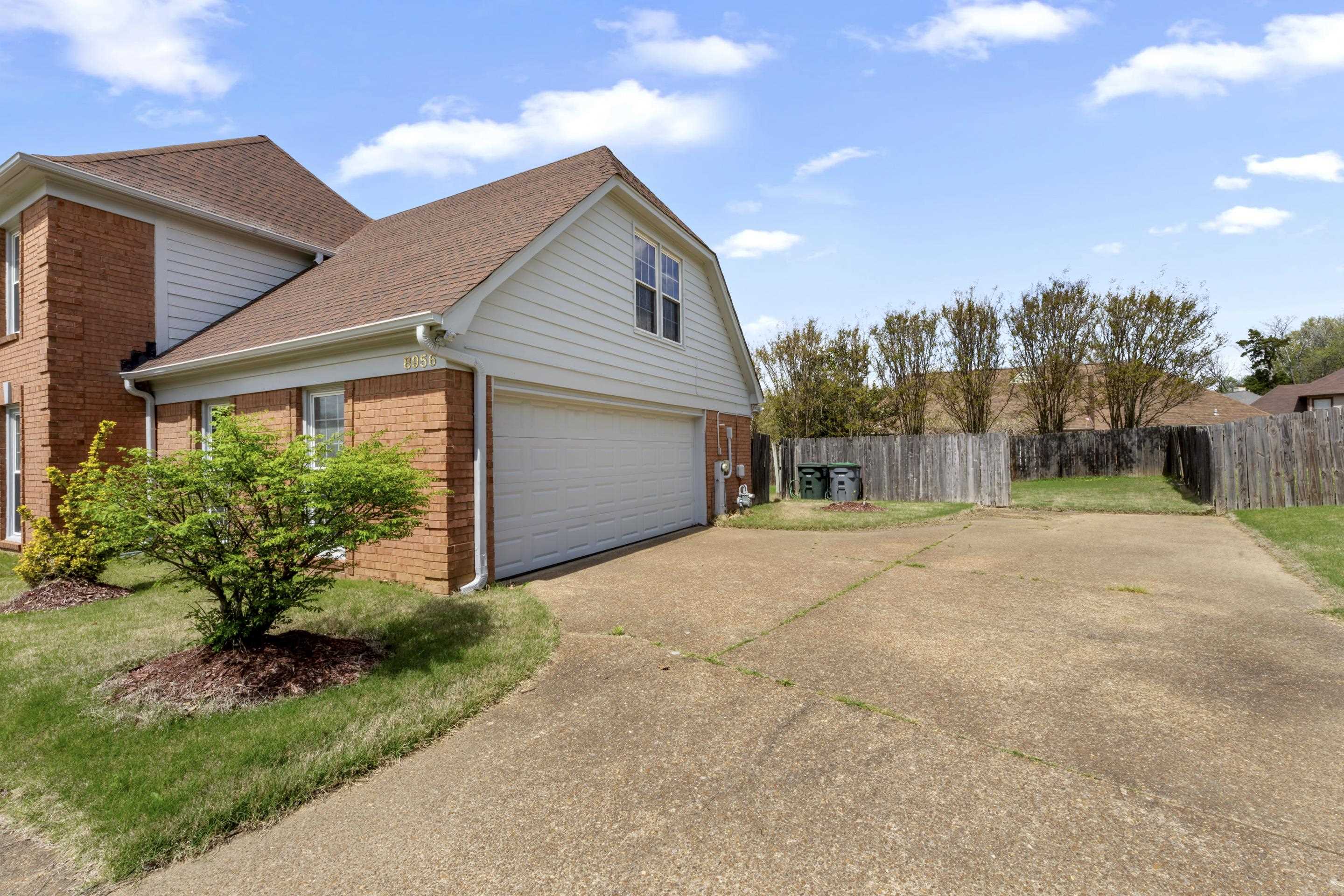 8956 Meadow Ridge Cove East Memphis, TN 38016 - Photo 4 of 28 a view of a house with backyard and garden