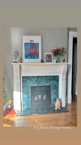 a living room with furniture a fireplace and a fireplace
