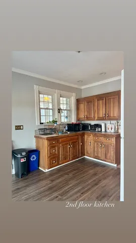 a large kitchen with stainless steel appliances granite countertop a large counter top and a stove