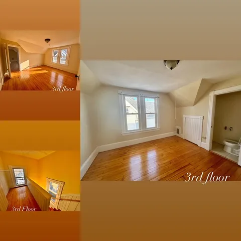 a view of a livingroom with wooden floor and a window