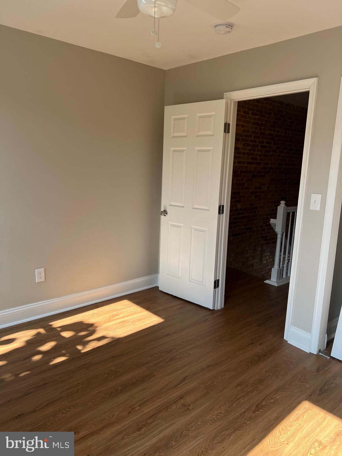 820 North Rose Street Baltimore, MD 21205 - Photo 13 of 20 a view of an empty room with wooden floor and closet