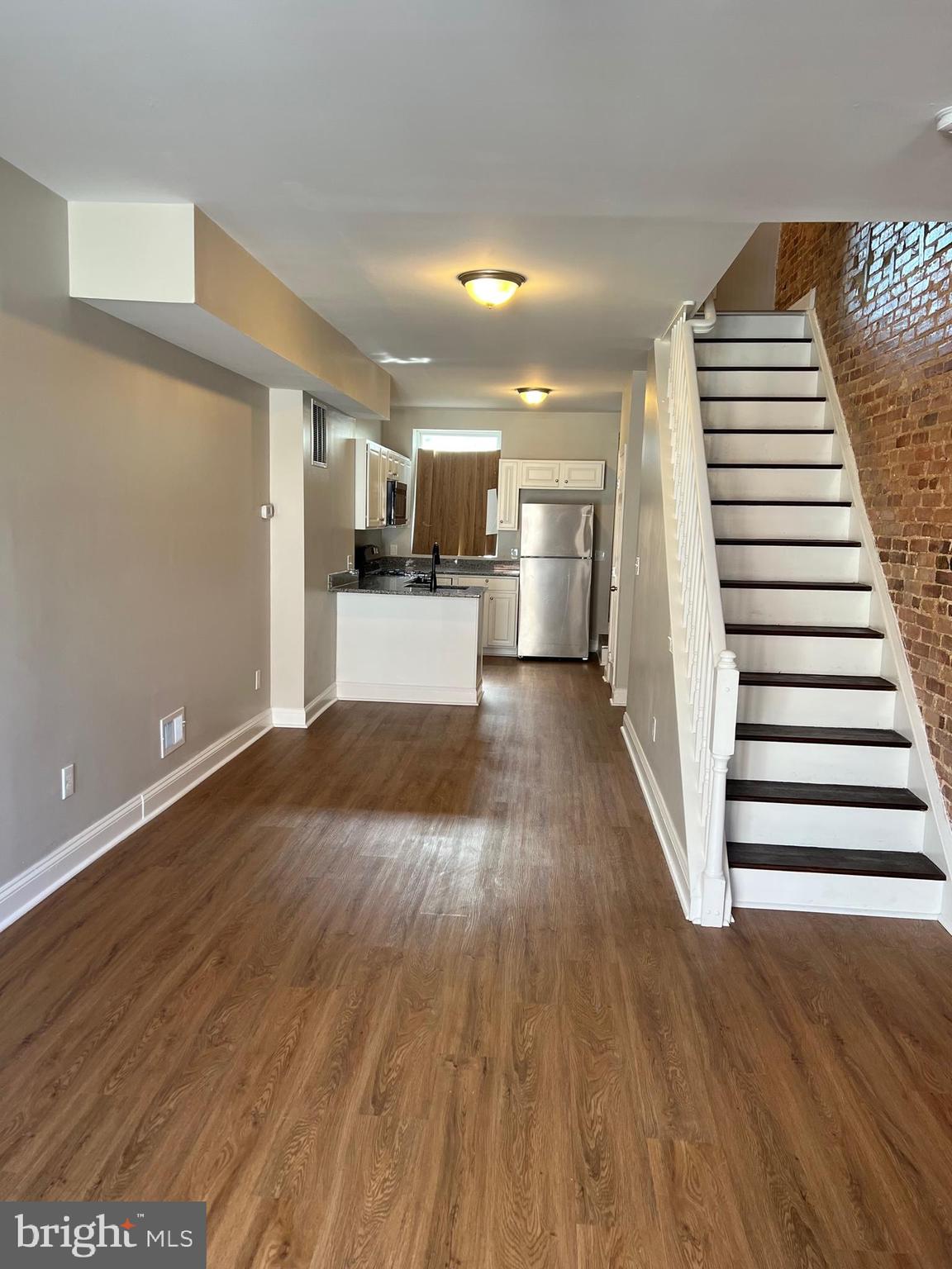 820 North Rose Street Baltimore, MD 21205 - Photo 2 of 20 a view of a kitchen with wooden floor and electronic appliances